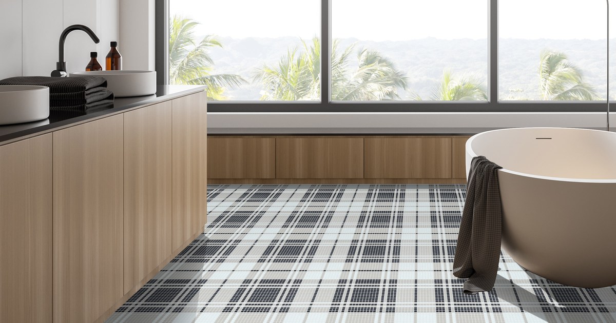 Avora Highland Preston plaid recycled glass mosaic bathroom floor beside a freestanding tub